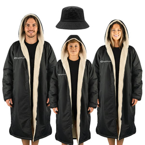 Three models in black Optimum Dry Wrap robes, cream fleece-lined hoods, black bucket hat, white background - Optimum