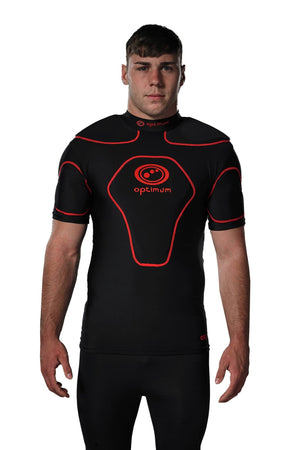 Man wearing black Optimum Origin rugby protective top with red trim and logo, front view - Optimum