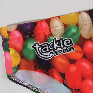 Optimum Tackle Trunks swim brief, close-up of tackle trunks logo on multicoloured jelly bean waistband - Optimum