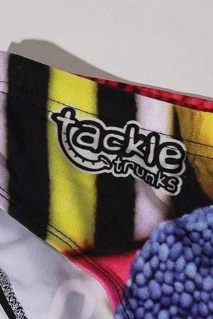 Optimum Tackle Trunks swim brief, close-up of tackle trunks logo on liquorice allsorts waistband - Optimum