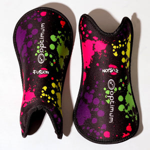 Pair of black Optimum Fusion hockey shin guards with paint-splatter print, front and back views on white - Optimum