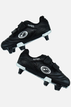 Black and white junior Optimum Razor football boots with twin touch-fasten straps and screw-in studs, pair - Optimum