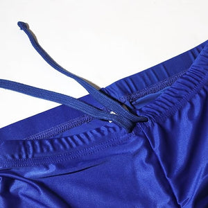 Close-up of royal blue Optimum Multi-X shorts waistband with drawstring, on white - Optimum
