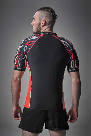 Black Optimum Razor protective top with red and white tribal-print shoulders, rear view on model - Optimum