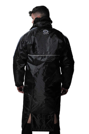 Man wearing long black Optimum sideline sub jacket, back view with reflective piping, on white - Optimum