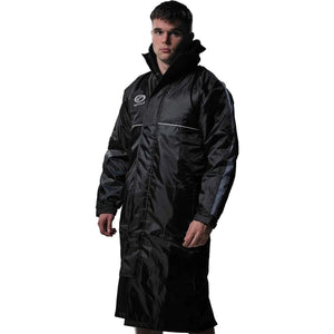 Man wearing long black Optimum sideline sub jacket, angled front view, on white - Optimum