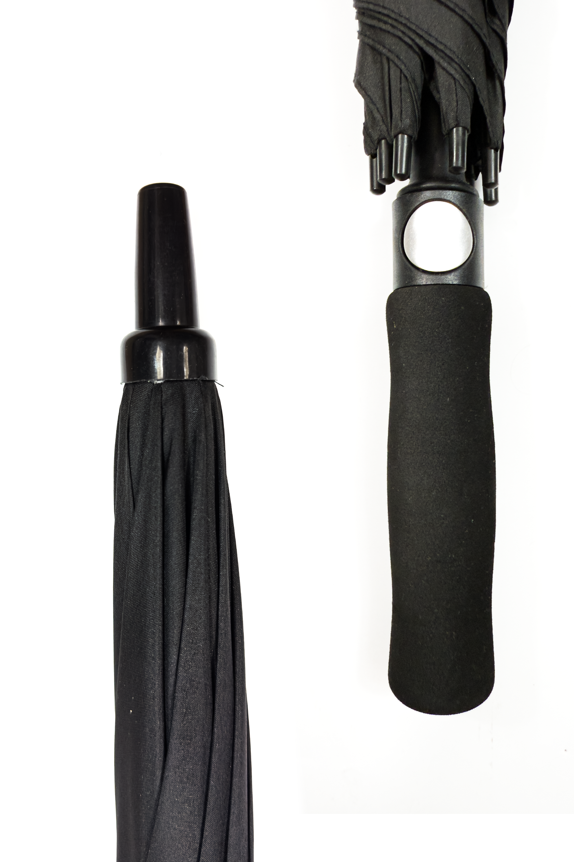 Close-up of black Optimum umbrella showing pointed tip and foam grip handle, on white - Optimum