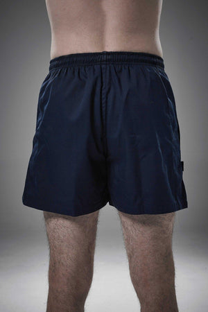 Man wearing navy Optimum Auckland rugby shorts, back view on grey studio background - Optimum