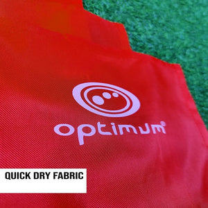 Close-up of red Optimum corner flag fabric with white logo on grass, Quick Dry Fabric text - Optimum