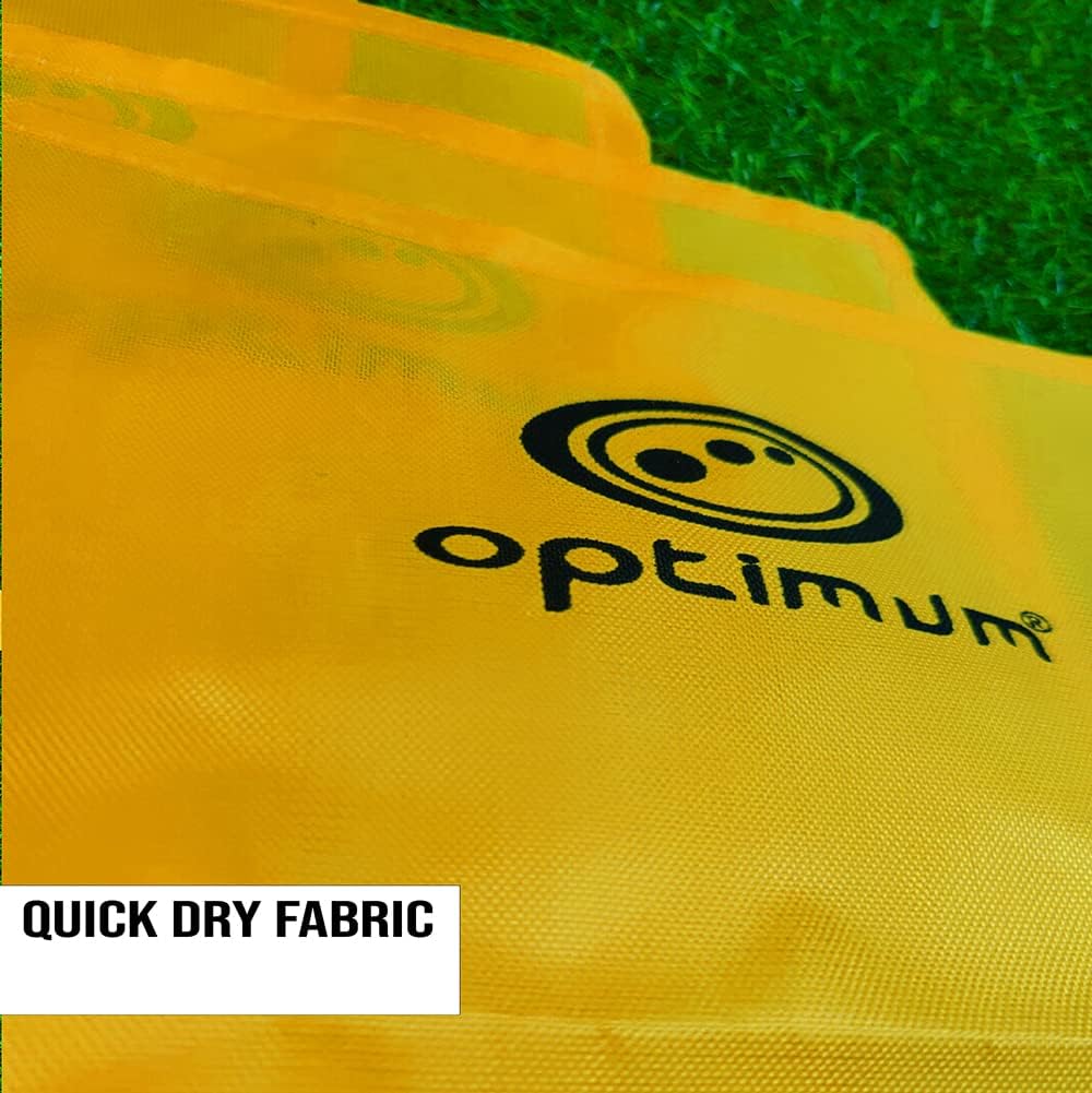 Close-up of yellow Optimum corner flag fabric with black logo on grass, Quick Dry Fabric text - Optimum
