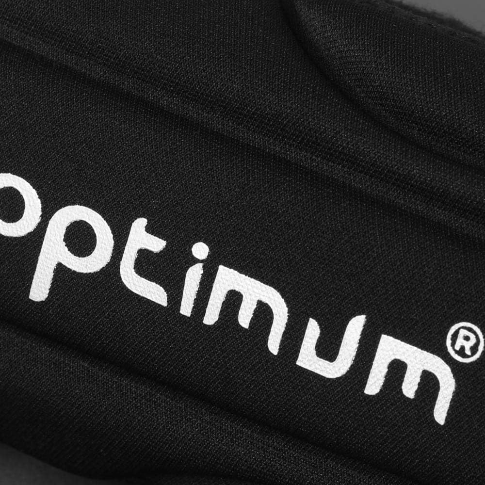 Macro close-up of white Optimum logo on black padded forearm guard fabric - Optimum