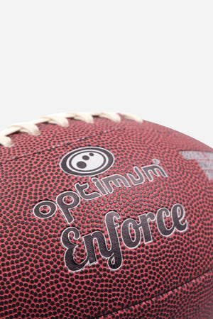 Close-up of maroon Optimum Enforce American football showing logo and pebbled grain - Optimum
