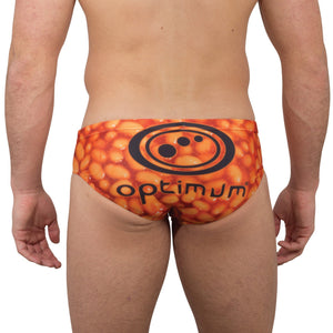 Optimum Tackle Trunks swim brief in orange baked beans print, rear view on male model with black Optimum logo - Optimum