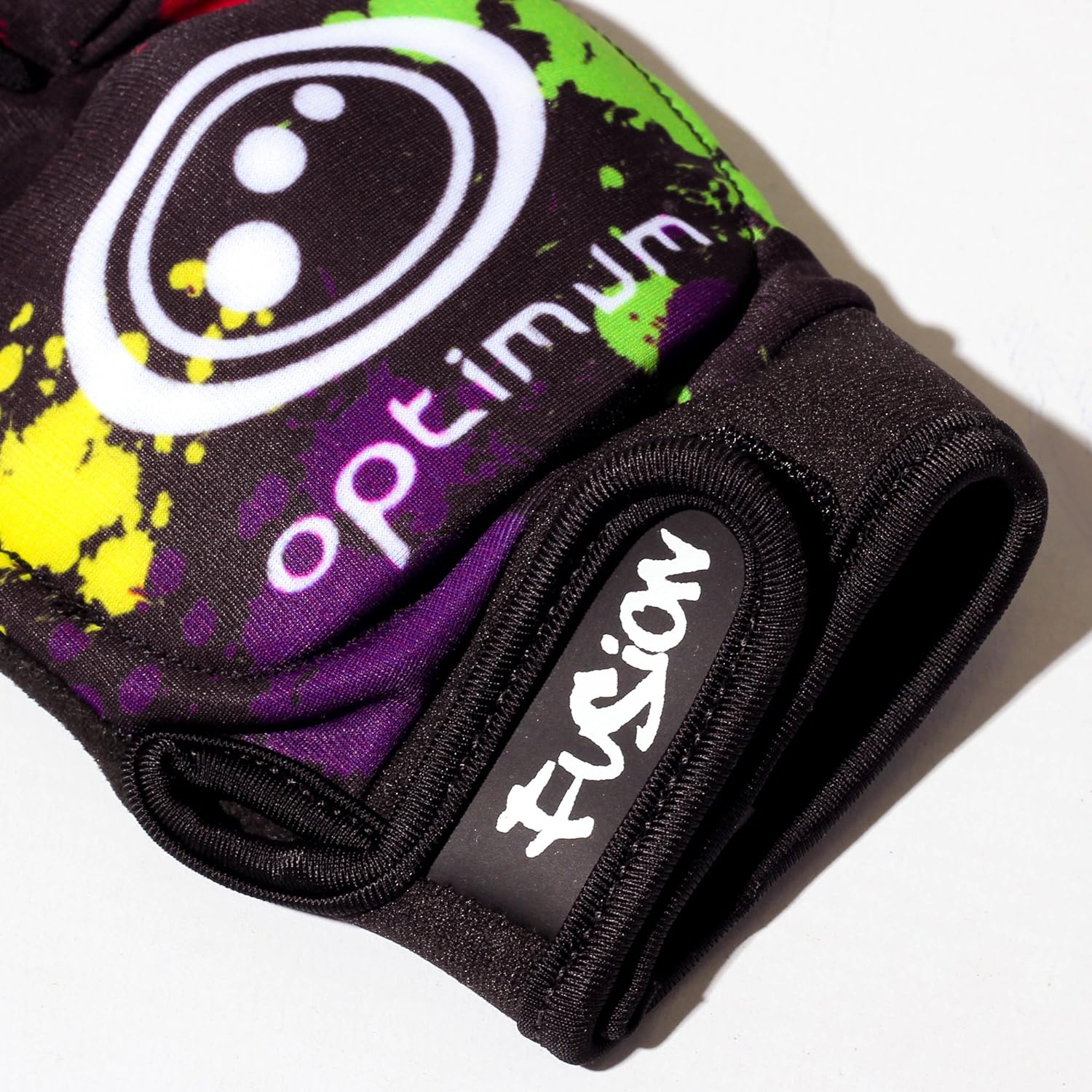 Close-up of black Optimum Fusion half-finger hockey glove with paint-splatter print, white logo and Fusion cuff - Optimum