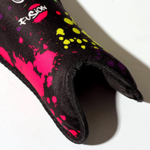 Close-up of black Optimum Fusion hockey shin guard with paint-splatter print and white Fusion print, on white - Optimum
